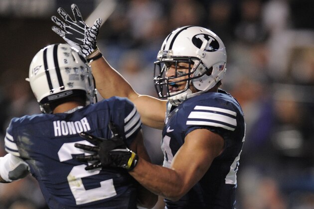 PROVO, UT - OCTOBER 12: Wide receiver Cody Hoffman #2 of the Brigham Young Cougars celebrates with teammate Algernon Brown #24, after Brown's touchdown against the Georgia Tech Yellow Jackets at LaVell Edwards Stadium October 12, 2013 in Provo, Utah. BYU beat Georgia Tech 38-20. (Photo by Gene Sweeney Jr/Getty Images)