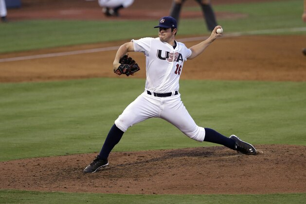 United States pitcher Carlos Rodon throws against Cuba during an exhibition baseball game in Durham, N.C., Tuesday, July 23, 2013. (AP Photo/Gerry Broome)
