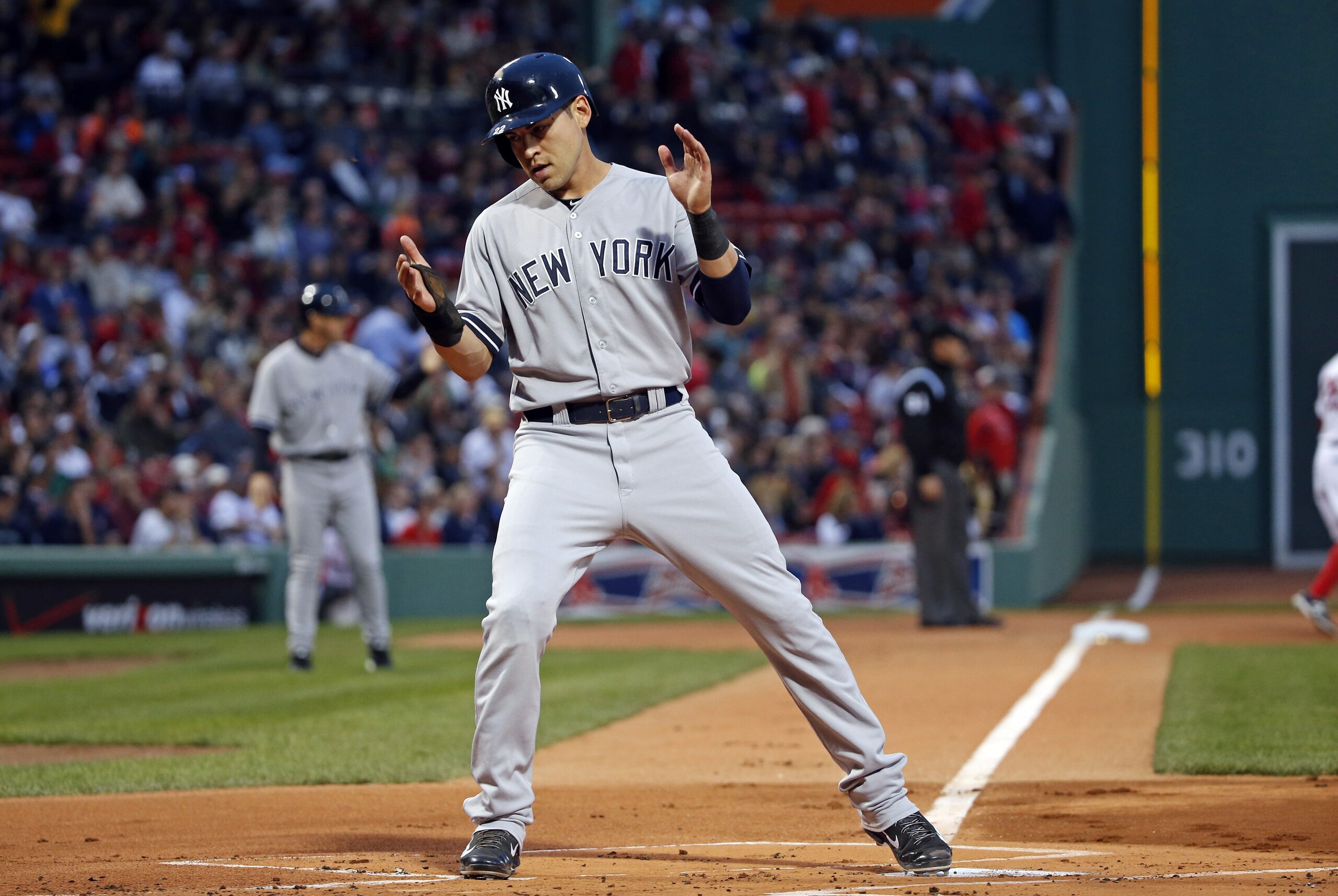 New York Yankees' Jacoby Ellsbury crosses home plate to score on a single by Derek Jeter during the first inning of a baseball game against the Boston Red Sox at Fenway Park in Boston, Tuesday, April 22, 2014. (AP Photo/Elise Amendola)