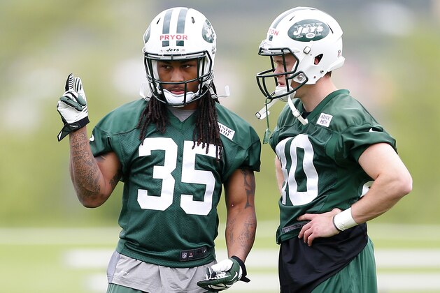 FLORHAM PARK, NJ - MAY 16: Safety's Calvin Pryor #35 and Chris Poston #40 of the New York Jets talk during the first day of rookie minicamp on May 16, 2014 in Florham Park, New Jersey. (Photo by Rich Schultz /Getty Images)