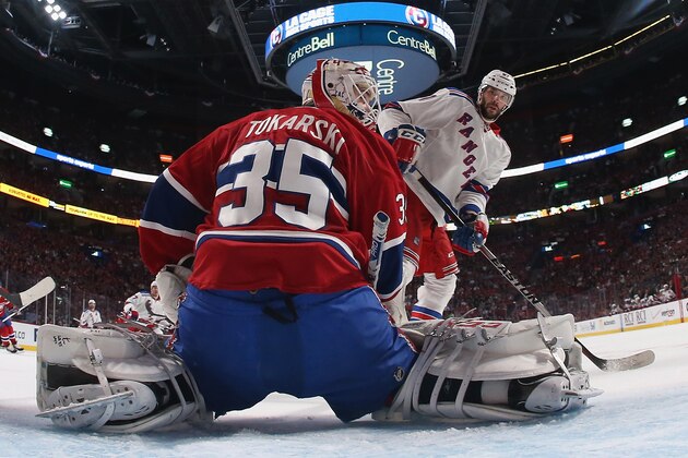 MONTREAL, QC - MAY 19: Benoit Pouliot #67 of the New York Rangers skates against Dustin Tokarski #35 of the Montreal Canadiens in Game Two of the Eastern Conference Final during the 2014 Stanley Cup Playoffs at the Bell Centre on May 19, 2014 in Montreal, Canada. The Rangers defeated the Canadiens 3-1.  (Photo by Bruce Bennett/Getty Images)