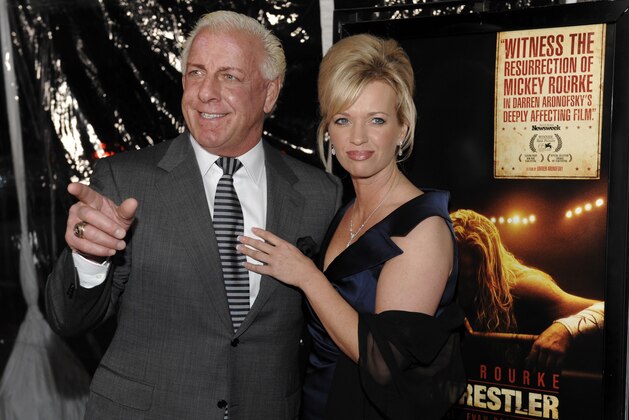 FILE - In this Dec. 16, 2008 file photo, former pro wrestler Ric Flair and his then girlfriend Jackie arrive at the premiere of the film