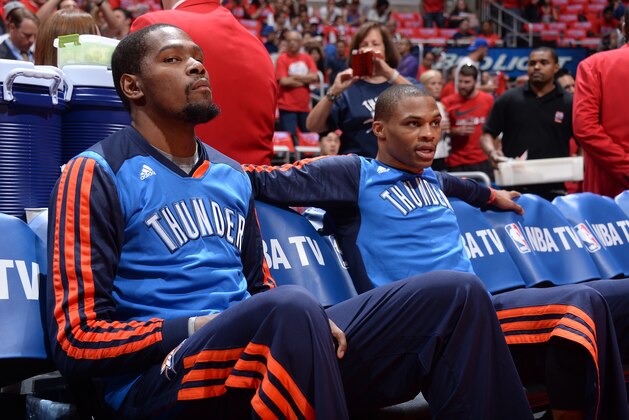 LOS ANGELES, CA - MAY 15:  Kevin Durant #35 and Russell Westbrook #0 of the Oklahoma City Thunder sit on the bench before Game Six of the Western Conference Semifinals against the Los Angeles Clippers during the 2014 NBA Playoffs at Staples Center on May 15, 2014 in Los Angeles, California. NOTE TO USER: User expressly acknowledges and agrees that, by downloading and/or using this Photograph, user is consenting to the terms and conditions of the Getty Images License Agreement. Mandatory Copyright Notice: Copyright 2014 NBAE (Photo by Andrew D. Bernstein/NBAE via Getty Images)
