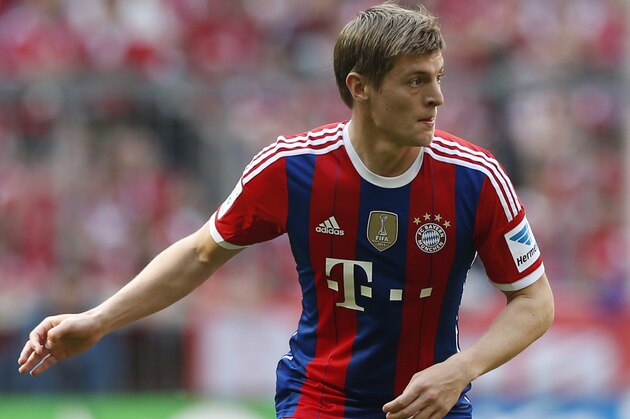Bayern's Toni Kroos watches his team mates during the German first division Bundesliga soccer match between FC Bayern Munich and VfB Stuttgart, in Munich, southern Germany, Saturday, May 10, 2014. (AP Photo/Matthias Schrader)