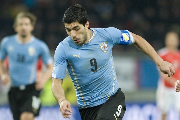 KLAGENFURT, AUSTRIA - MARCH 05:  Luis Suarez of Uruguay runs with the ball during the international friendly match between Austria and Uruguay at Woerthersee stadium on March 5, 2014 in Klagenfurt, Austria.  (Photo by Winnie Pessentheiner/Getty Images)