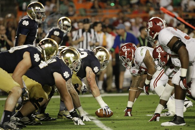 Notre Dame quarterback Everett Golson (5) works against Alabama during the first half of the BCS National Championship college football game Monday, Jan. 7, 2013, in Miami. (AP Photo/David J. Phillip)