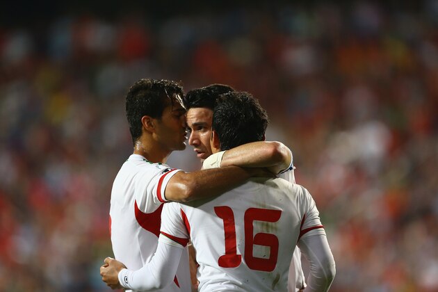 ULSAN, SOUTH KOREA - JUNE 18:  Reza Ghoochannejad and javad nekounam and Masoud shojaei in celebration during the FIFA 2014 World Cup Qualifier match between South Korea and Iran at Munsu Cup Stadium on June 18, 2013 in Ulsan, South Korea.  (Photo by Amin M. Jamali/Getty Images)