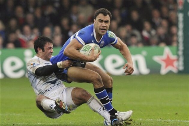 Bath's Olly Woodburn, right, is tackled by Montpellier's Paul Bosch during their Heineken Cup pool 3 rugby match at the Recreation ground, Bath, England, Sunday, Nov. 20, 2011. (AP Photo/Tom Hevezi)