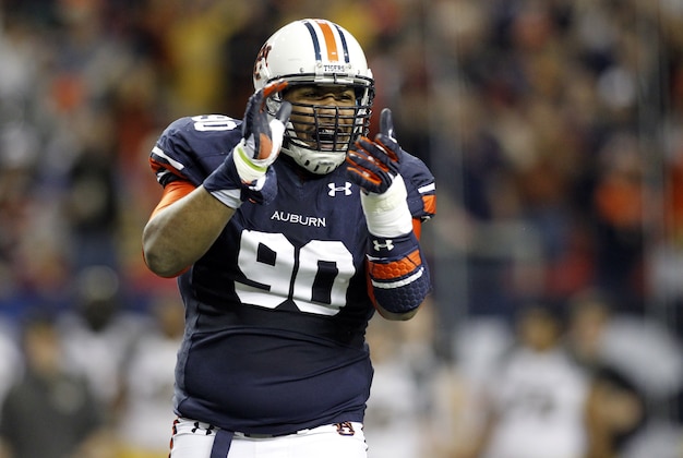 Dec 7, 2013; Atlanta, GA, USA; Auburn Tigers defensive lineman Gabe Wright (90) reacts during the first quarter of the 2013 SEC Championship game against the Missouri Tigers at Georgia Dome. Mandatory Credit: Brett Davis-USA TODAY Sports