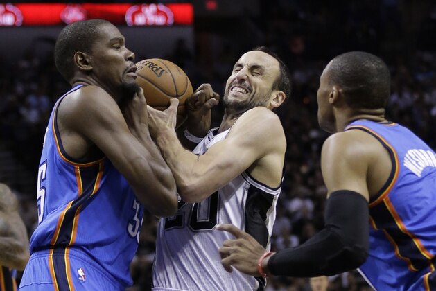 San Antonio Spurs' Manu Ginobili, center, tries to drive between Oklahoma City Thunder's Kevin Durant, left, and Russell Westbrook during the first half of Game 2 of the Western Conference finals NBA basketball playoff series, Wednesday, May 21, 2014, in San Antonio. (AP Photo/Eric Gay)