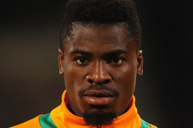 CASABLANCA, MOROCCO - NOVEMBER 16:  Serge Aurier of Ivory Coast lines up for the National Anthem ahead of the FIFA 2014 World Cup Qualifier Play-off Second Leg between Senegal and Ivory Coast at Stade Mohammed V on November 16, 2013 in Casablanca, Morocco.  (Photo by Mike Hewitt/Getty Images)