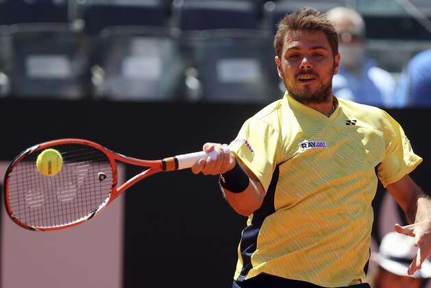 Switzerland's Stanislas Wawrinka returns the ball to Germany's Tommy Haas during their match at the Italian open tennis tournament in Rome, Thursday, May 15, 2014. (AP Photo/Gregorio Borgia)