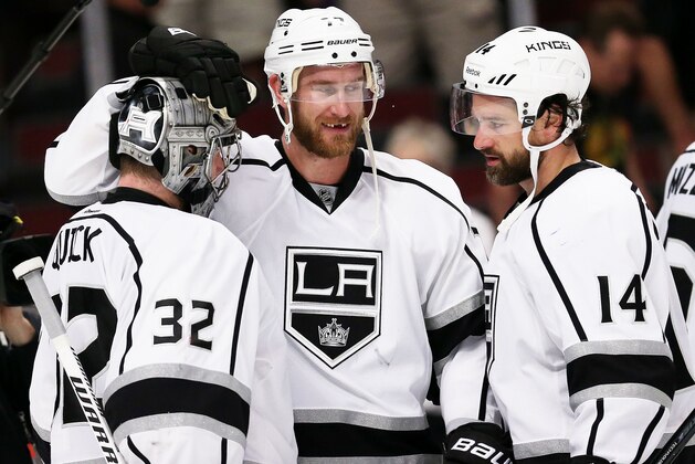 CHICAGO, IL - MAY 21:  Jonathan Quick #32, Jeff Carter #77 and Justin Williams #14 of the Los Angeles Kings celebrate their 6 to 2 win over the Chicago Blackhawks in Game Two of the Western Conference Final during the 2014 Stanley Cup Playoffs at United Center on May 21, 2014 in Chicago, Illinois.  (Photo by Jonathan Daniel/Getty Images)