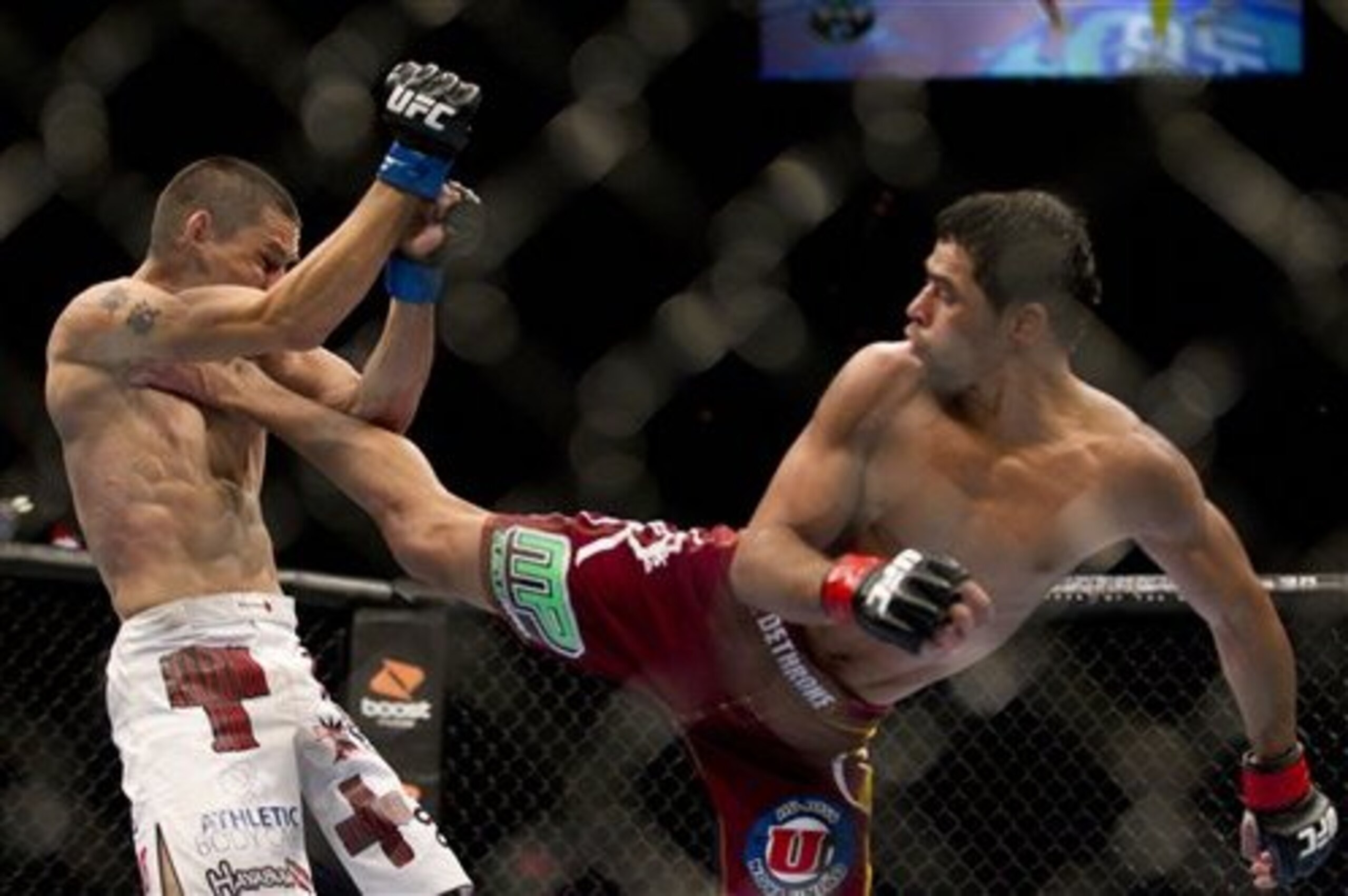 Cole Escovedo, left, and Renan Barao during a bantamweight bout at UFC 130, Saturday, May 28, 2011, in Las Vegas. (AP Photo/Julie Jacobson)