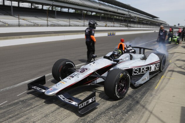 Kurt Busch drives out of the pit area during practice for the Indianapolis 500 IndyCar auto race at the Indianapolis Motor Speedway in Indianapolis, Monday, May 19, 2014. (AP Photo/Michael Conroy)