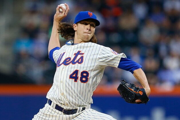 NEW YORK, NY - MAY 15:  Jacob deGrom #48 of the New York Mets pitches in the second inning against the New York Yankees on May 15, 2014 at Citi Field in the Flushing neighborhood of the Queens borough of New York City.  (Photo by Mike Stobe/Getty Images)