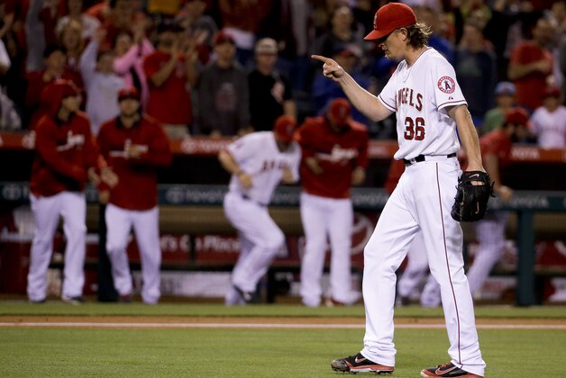 Los Angeles Angels starting pitcher Jered Weaver celebrates their 2-1 win against the Houston Astros during a baseball game in Anaheim, Calif., Wednesday, May 21, 2014. (AP Photo/Chris Carlson)