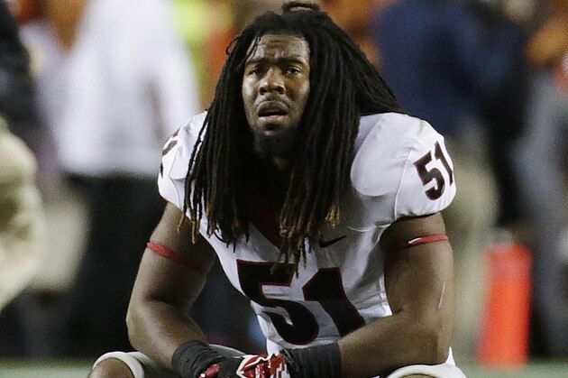 Georgia linebacker Ramik Wilson (51) reacts after Auburn scored the game-winning touchdown late in the second half of an NCAA college football game in Auburn, Ala., Saturday, Nov. 16, 2013. Auburn beat Georgia 43-38. (AP Photo/Dave Martin)