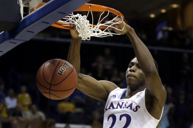 Kansas' Andrew Wiggins dunks the ball during the second half of a second-round game against Eastern Kentucky in the NCAA college basketball tournament Friday, March 21, 2014, in St. Louis. Kansas won 80-69. (AP Photo/Jeff Roberson)