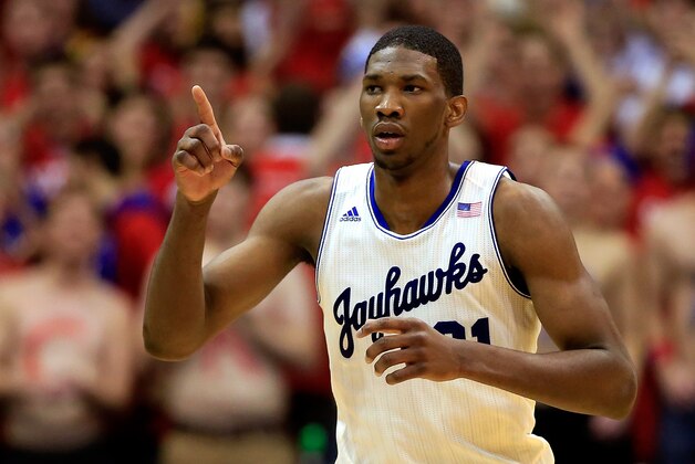 LAWRENCE, KS - JANUARY 18:  Joel Embiid #21 of the Kansas Jayhawks reacts after scoring during the game against the Oklahoma State Cowboys at Allen Fieldhouse on January 18, 2014 in Lawrence, Kansas.  (Photo by Jamie Squire/Getty Images)