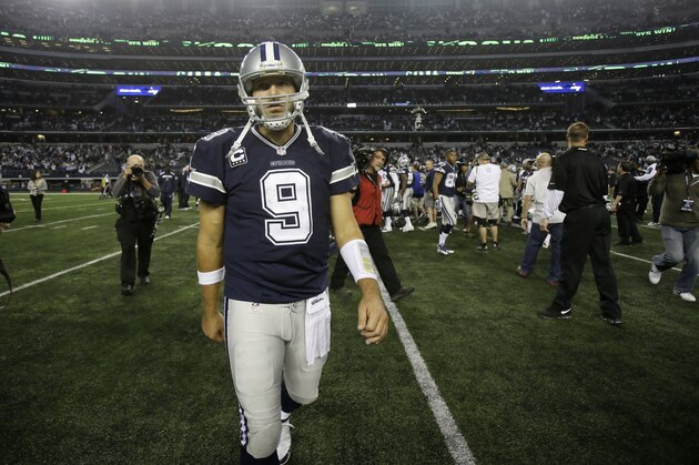 Dallas Cowboys quarterback Tony Romo (9) walks off the field after an NFL football game against the Oakland Raiders Thursday, Nov. 28, 2013, in Arlington, Texas.  The Cowboys won 31-24. (AP Photo/Tim Sharp)