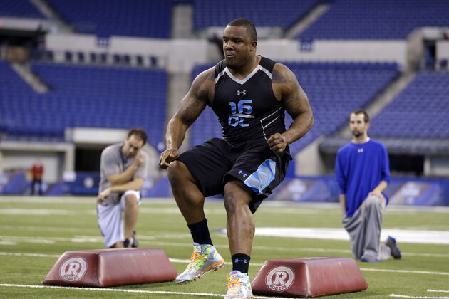 Minnesota defensive lineman Ra'Shede Hageman runs a drill at the NFL football scouting combine in Indianapolis, Monday, Feb. 24, 2014. (AP Photo/Michael Conroy)