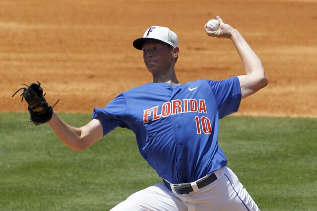 Florida's A.J. Puk (10) pitches against South Carolina during the 2nd inning at the Southeastern Conference NCAA college baseball tournament on Thursday, May 22, 2014, in Hoover, Ala. (AP Photo/Butch Dill)