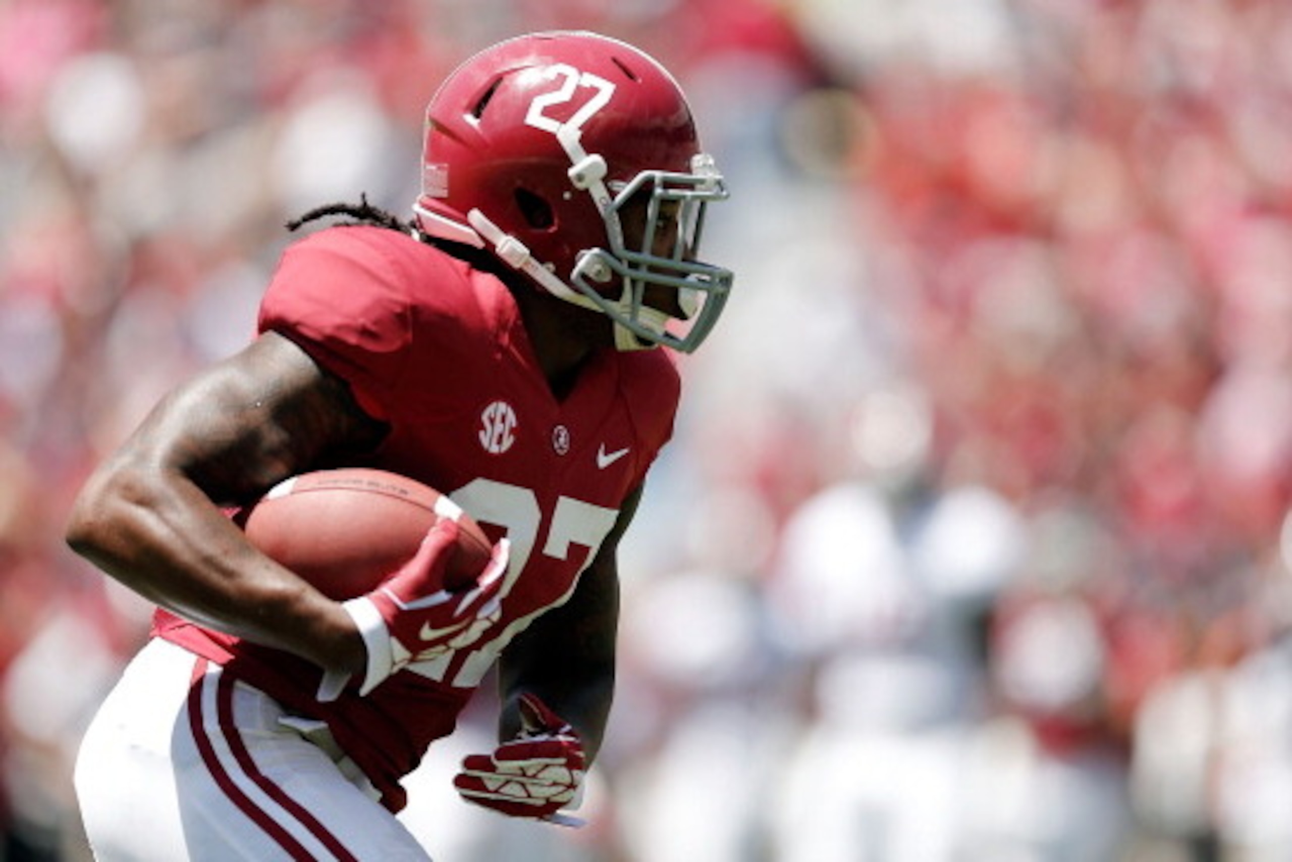 TUSCALOOSA, AL - APRIL 19: Derrick Henry #27 of the Crimson team runs for yards against the White team during the University of Alabama A-Day spring game at Bryant-Denny Stadium on April 19, 2014 in Tuscaloosa, Alabama. (Photo by Stacy Revere/Getty Images) TUSCALOOSA, AL - APRIL 19: Derrick Henry #27 of the Crimson team runs for yards against the White team during the University of Alabama A-Day spring game at Bryant-Denny Stadium on April 19, 2014 in Tuscaloosa, Alabama. (Photo by Stacy Revere/Getty Images)
