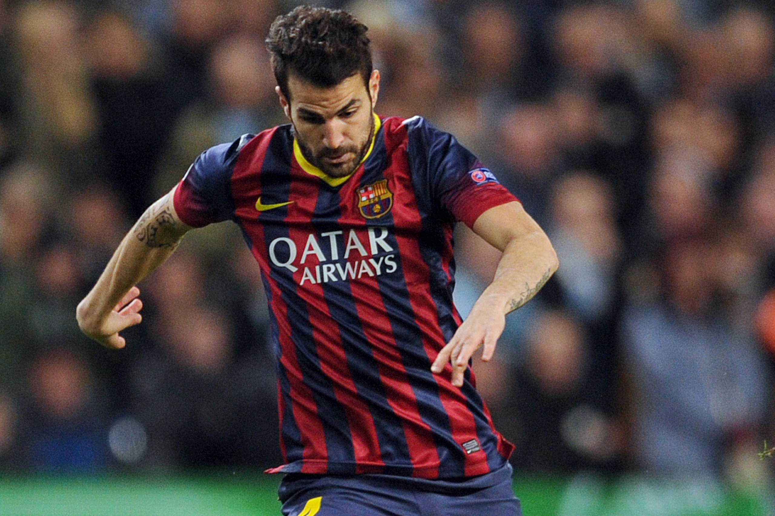 Barcelona's Cesc Fabregas during their Champions League Round of 16 soccer match against Manchester City at the Etihad Stadium in Manchester, England, Tuesday, Feb. 18, 2014. (AP Photo/Clint Hughes)