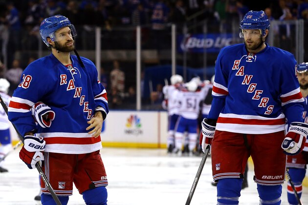 NEW YORK, NY - MAY 22: Dominic Moore #28 of the New York Rangers and teammate Rick Nash #61
skate off the ice after Alex Galchenyuk #27 of the Montreal Canadiens scores the game winning overtime goal in Game Three of the Eastern Conference Final during the 2014 NHL Stanley Cup Playoffs at Madison Square Garden on May 22, 2014 in New York City.Canadiens defeated the Rangers 3-2 in OT.  (Photo by Al Bello/Getty Images)