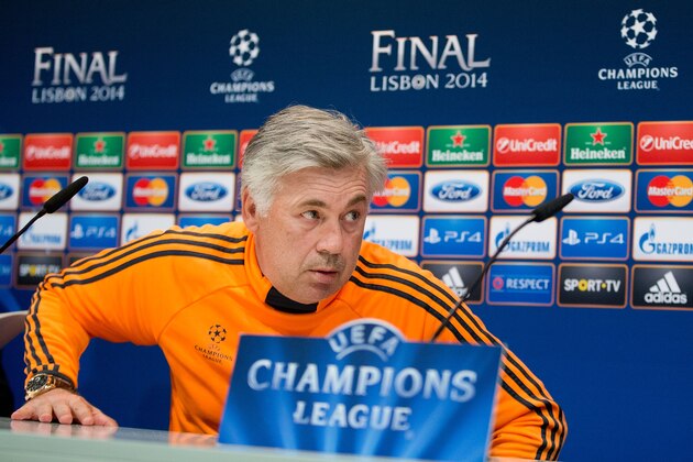 MADRID, SPAIN - MAY 20:  Head coach Carlo Ancelotti of Real Madrid CF leaves the press conference during the Real Madrid media day, ahead of the UEFA Champions League final against Club Atletico de Madrid, at Valdebebas Sport City on May 20, 2014 in Madrid, Spain.  (Photo by Gonzalo Arroyo Moreno/Getty Images)