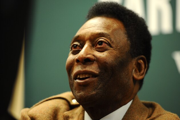 NEW YORK, NY - APRIL 01: Pele greets a fan during his book signing to promote 'Why Soccer Matters' at Barnes & Noble, 5th Avenue on April 1, 2014 in New York City.  (Photo by Maddie Meyer/Getty Images)