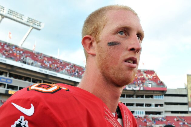 TAMPA, FL -  DECEMBER 8:  Quarterback Mike Glennon #8 of the Tampa Bay Buccaneers leaves the field after play against the Buffalo Bills December 8, 2013 at Raymond James Stadium in Tampa, Florida.  The Buxs won 27 - 6.  (Photo by Al Messerschmidt/Getty Images)