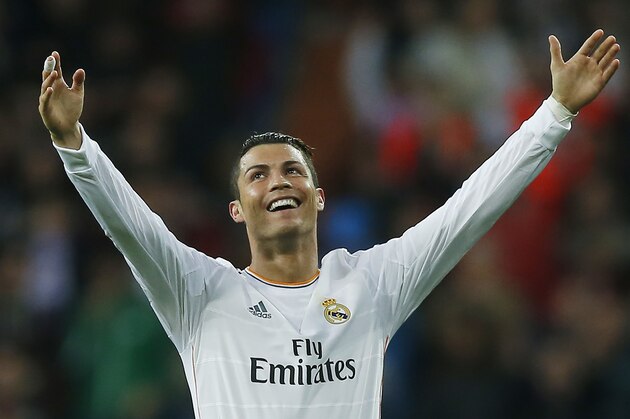 Real's Cristiano Ronaldo celebrates his second goal during a Spanish La Liga soccer match between Real Madrid and Osasuna at the Santiago Bernabeu stadium in Madrid, Spain, Saturday, April 26, 2014. (AP Photo/Andres Kudacki)