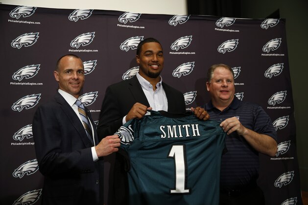 Newly-drafted Philadelphia Eagles' Marcus Smith, center, poses with team president Don Smolenski, left, and head coach Chip Kelly before an NFL football news conference at the team's practice facility, Friday, May 9, 2014, in Philadelphia. Smith was selected in the first round, 26th overall, by the Philadelphia Eagles in the NFL draft on Thursday, May 8, 2014. (AP Photo/Matt Slocum)