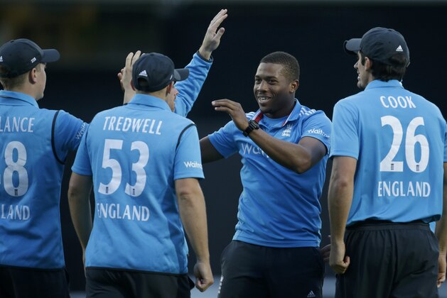 England bowler Chris Jordan, second right, after taking the wicket of Sri Lanka's Tillakaratne Dilshan who was caught out by Harry Gurney during the One Day cricket match between England and Sri Lanka at the Oval cricket ground in London, Thursday, May 22, 2014.  (AP Photo/Matt Dunham)
