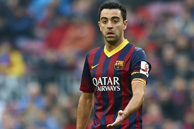BARCELONA, SPAIN - FEBRUARY 01:  Xavi Hernandez of FC Barcelona runs with the ball during the La Liga match between FC Barcelona and Valencia CF at Camp Nou on February 1, 2014 in Barcelona, Spain.  (Photo by Manuel Queimadelos Alonso/Getty Images)