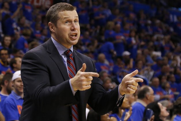 Memphis Grizzlies head coach David Joerger gestures to an official in the third quarter of Game 7 of an opening-round NBA basketball playoff series against the Oklahoma City Thunder in Oklahoma City, Saturday, May 3, 2014. Oklahoma City won 120-109. (AP Photo/Sue Ogrocki)