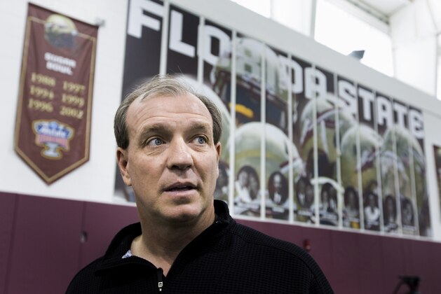 Florida State coach Jimbo Fisher talks to attendees during pro day held for NFL football scouts, Tuesday, March 18, 2014, in Tallahassee, Fla. (AP Photo/Colin Hackley)