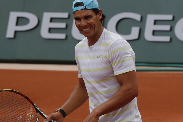 Defending champion Spain's Rafael Nadal smiles during a training session for the French Open tennis tournament, at the Roland Garros stadium in Paris, Friday, May 23, 2014. The French Open tennis championship will start Sunday. (AP Photo/Bertrand Combaldieu)