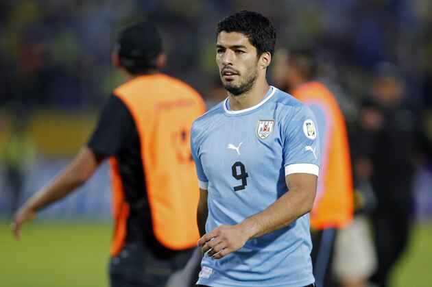 FILE - In this Friday, Oct. 11, 2013 file photo, Uruguay's Luis Suarez walks off the pitch at the end of a 2014 World Cup qualifying soccer game against Ecuador in Quito, Ecuador.  Uruguay striker Luis Suarez has undergone keyhole surgery on his knee and is expected to recover in time for the World Cup. The mother of the 27-year-old Liverpool striker says he had surgery Thursday to repair damage to his meniscus. Sandra Diaz tells The Associated Press that the surgery was successful and that he is expected to recover in 2-3 weeks. Uruguay plays its first match at the World Cup against Costa Rica on June 14. The team will then face England on June 19 and Italy on June 24. (AP Photo/Martin Mejia, file)
