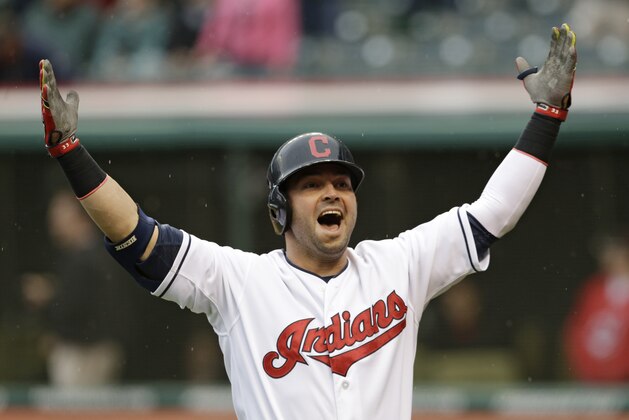 Cleveland Indians' Nick Swisher celebrates after hitting a solo home run off Oakland Athletics starting pitcher Sonny Gray in the first inning of a baseball game, Friday, May 16, 2014, in Cleveland. (AP Photo/Tony Dejak)