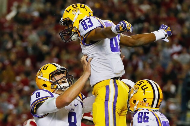TUSCALOOSA, AL - NOVEMBER 09:  Travin Dural #83 of the LSU Tigers celebrates his touchdown reception with teammate Zach Mettenberger #8 in the second quarter against the Alabama Crimson Tide at Bryant-Denny Stadium on November 9, 2013 in Tuscaloosa, Alabama.  (Photo by Kevin C. Cox/Getty Images)