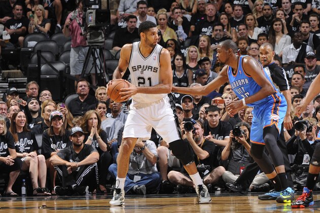 SAN ANTONIO, TX - MAY 19: Tim Duncan #21 of the San Antonio Spurs handles the ball against Kevin Durant #35 of the Oklahoma City Thunder in Game One of the Western Conference Finals during the 2014 NBA Playoffs on May 19, 2014 at the AT&T Center in San Antonio, Texas. NOTE TO USER: User expressly acknowledges and agrees that, by downloading and/or using this Photograph, user is consenting to the terms and conditions of the Getty Images License Agreement. Mandatory Copyright Notice: Copyright 2014 NBAE (Photo by D. Clarke Evans/NBAE via Getty Images)