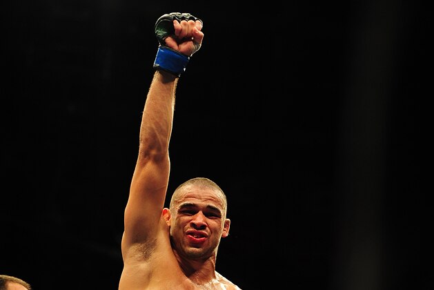 Jul 21, 2012; Calgary, AB, CANADA; Renan Barao celebrates defeating Urijah Faber (not pictured) in the interim bantamweight title bout of UFC 149 at the Scotiabank Saddledome. Mandatory Credit: Anne-Marie Sorvin-USA TODAY Sports