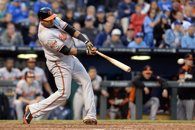 May 17, 2014; Kansas City, MO, USA; Baltimore Orioles left fielder Nelson Cruz (23) connects for a single in the eighth inning against the Kansas City Royals at Kauffman Stadium. The Royals won 1-0. Mandatory Credit: Denny Medley-USA TODAY Sports