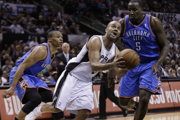 San Antonio Spurs' Tony Parker (9), of France, drives past Oklahoma City Thunder's Russell Westbrook, left, and Kendrick Perkins (5) during the first half of Game 2 of a Western Conference finals NBA basketball playoff series, Wednesday, May 21, 2014, in San Antonio. (AP Photo/Eric Gay)