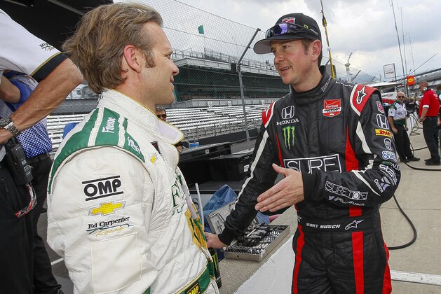 INDIANAPOLIS, IN - MAY 11: Kurt Busch driver of the #26 Honda talks to Ed Carpenter, driver of the #20 Ed Carpenter Racing Chevrolet Dallara practice for the Indy 500 at the Indianapolis Motor Speedway on May 11, 2014 in Indianapolis, Indiana. (Photo by Michael Hickey/Getty Images)