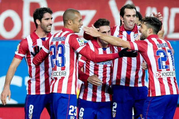 MADRID, SPAIN - FEBRUARY 02: Joao Miranda (2ndL) celebrates scoring their third goal with teammates Diego Ribas (R), Diego Godin (2ndR), Koke (3dR) and Raul Garcia (L) during the La Liga match between Club Atletico de Madrid and Real Sociedad de Futbol at Vicente Calderon Stadium on February 2, 2014 in Madrid, Spain.  (Photo by Gonzalo Arroyo Moreno/Getty Images)