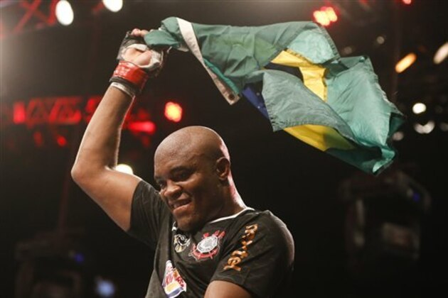 Anderson Silva, from Brazil, celebrates after defeating Stephan Bonnar, from the United States, during their light heavyweight mixed martial arts bout at UFC153 in Rio de Janeiro, early Sunday, Oct. 14, 2012. (AP Photo/Felipe Dana)